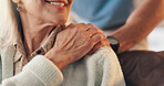 Old woman, shoulder and caregiver in nursing home with holding hands, healthcare help and support. Senior person, smile and worker in retirement center with trust, empathy or compassion for kindness.