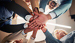 Hand stack, teamwork and business people in office with support, solidarity or collaboration. Synergy, partnership and group of corporate employees in circle with connection in meeting from below.