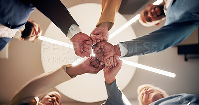 Buy stock photo Business people, hands or unity with fist bump below for teamwork, solidarity or success together. Low angle, group or employees in circle with collaboration for mission, social cohesion or inclusion