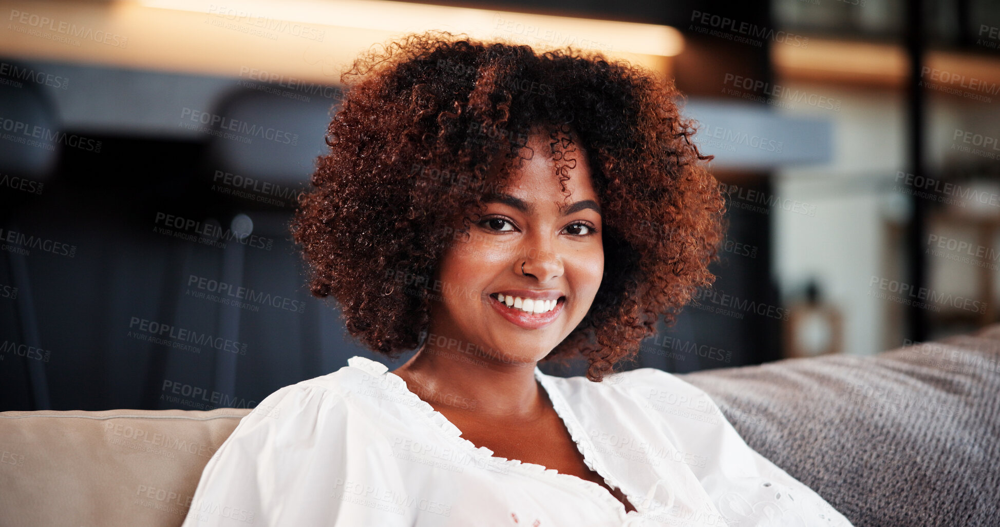 Buy stock photo Happy, portrait and woman on sofa, relax and confident on break in living room, home and comfortable. Lounge, chill and black person with smile on weekend, peace and calm on couch or resting in house