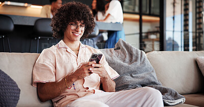 Buy stock photo Phone, relax and man on sofa in home with networking, communication or social media on mobile app. Happy, cellphone and male person reading blog with celebrity gossip in living room at house.