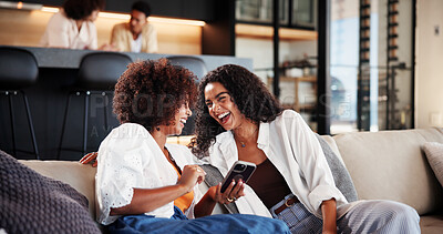 Buy stock photo Women, friends and laugh on sofa with phone in home, share meme or funny video in living room. People, smartphone and relax on couch with joke, post and mobile app for social media at apartment