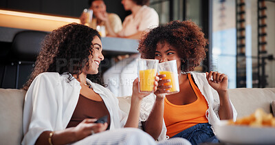 Buy stock photo People, tv and cheers with juice at house for watching movies, reunion and bonding together. Smile, friends and toast with beverage for celebration, social gathering and streaming film in living room