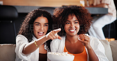 Buy stock photo Women, friends and watching tv with popcorn on couch, laugh or eating with funny movie in living room. People, happy and relax on sofa with streaming, bonding and film subscription in lounge at home