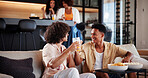 Men, friends and watching tv on sofa with toast, celebration and excited for sports game in living room. People, happy and drinks on couch with streaming, subscription or television in lounge at home