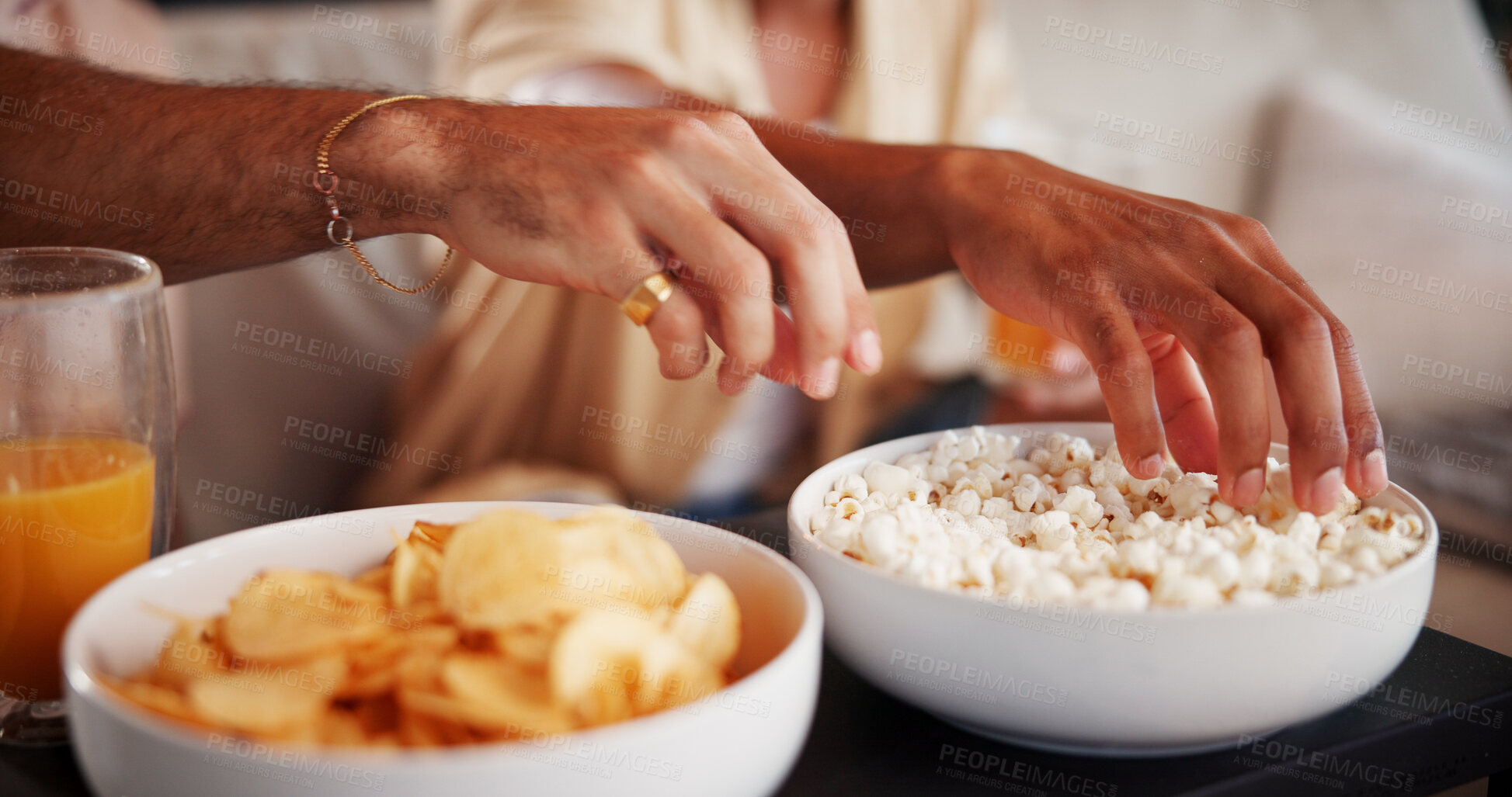 Buy stock photo Hands, friends and popcorn in home for watching tv with movies, streaming service and relax in lounge. People. bowl and snacks with eating, hungry and drinks with film, bonding or television at house