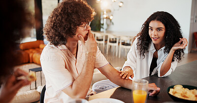 Buy stock photo Couple of friends, lunch and talk with gossip in home for reunion, break and story with snacks. Man, women and smile with funny conversation, memory or discussion with juice and chat at apartment