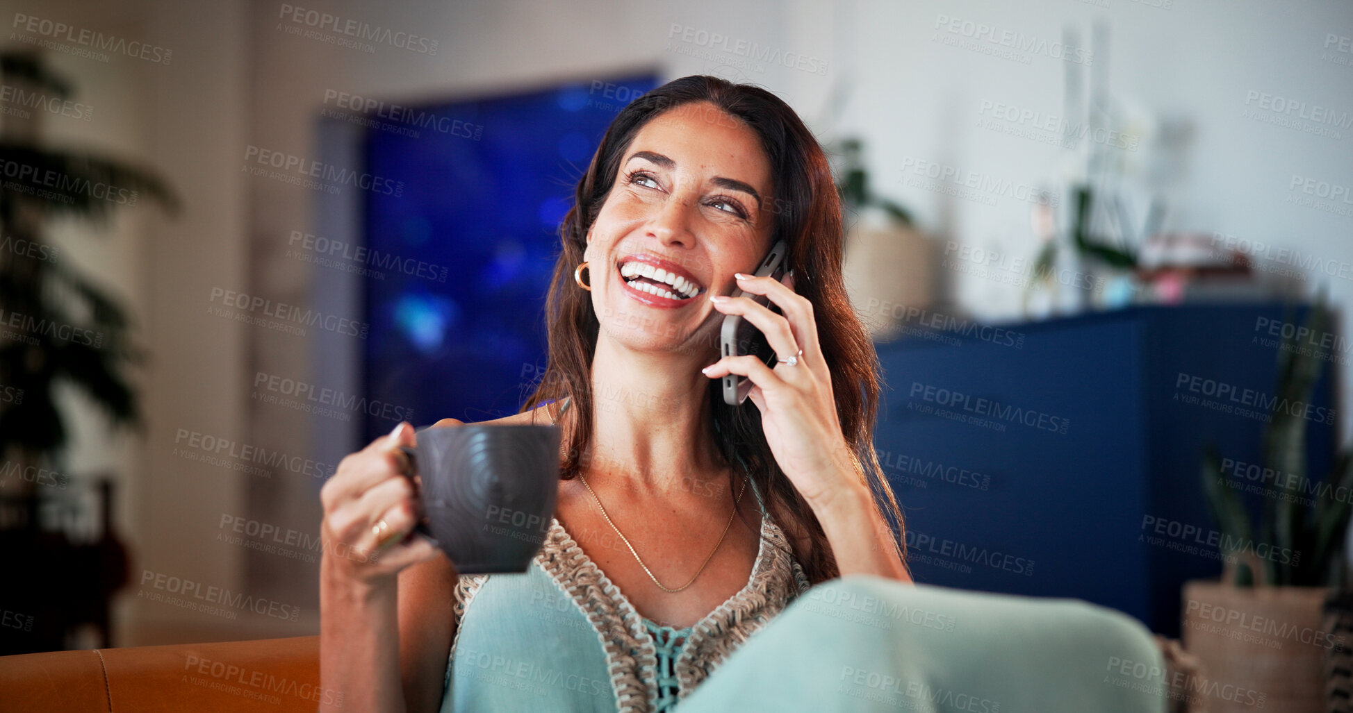 Buy stock photo Phone call, coffee and woman on sofa in home with laughing for communication, networking or gossip. Happy, cellphone and female person with warm beverage for mobile conversation in living room.