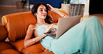 Relax, laptop and woman with streaming on couch, weekend series binge and movie for entertainment. Comfortable, pc or mature person with connection for film subscription service, watch online or home