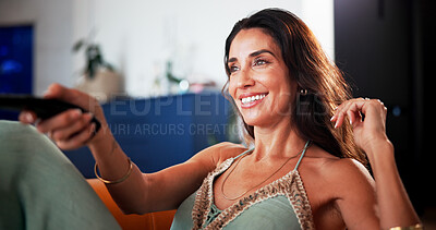 Buy stock photo Happy woman, relax and watching tv with remote for entertainment or online subscription in home. Mature person, sofa or streaming with smile or channel on couch for movie, series or news in house