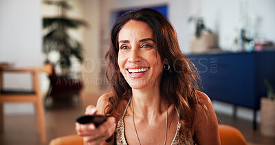 Buy stock photo Remote, happy and woman watching tv in home with comedy movie, series or film online in living room. Laugh, smile and female person on sofa streaming funny show with subscription in apartment.