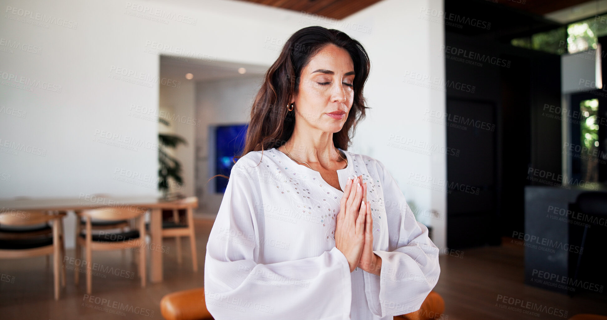 Buy stock photo Meditation, prayer hands and woman in home for wellness, self care or health in living room. Yoga, calm and female person with balance for peace, zen or grounding exercise in morning at apartment.