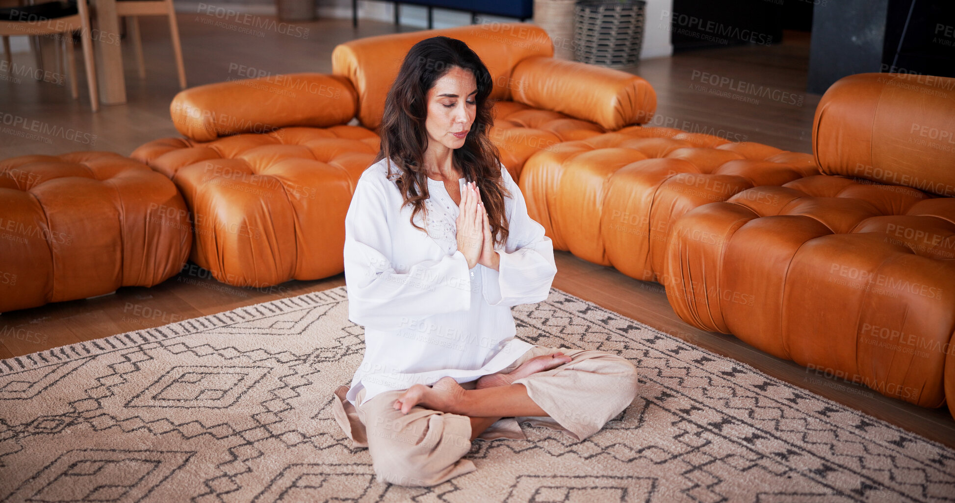 Buy stock photo Meditation, praying hands and woman in home for wellness, self care or health in living room. Yoga, calm and mature female person with balance for peace, zen or grounding exercise in morning at house