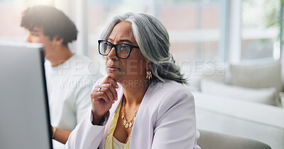 Buy stock photo Reading, glasses and woman with computer, office and serious for article on web, reporter and online. Coworking, mature journalist and person with eyewear for story, vision and editing in newsroom