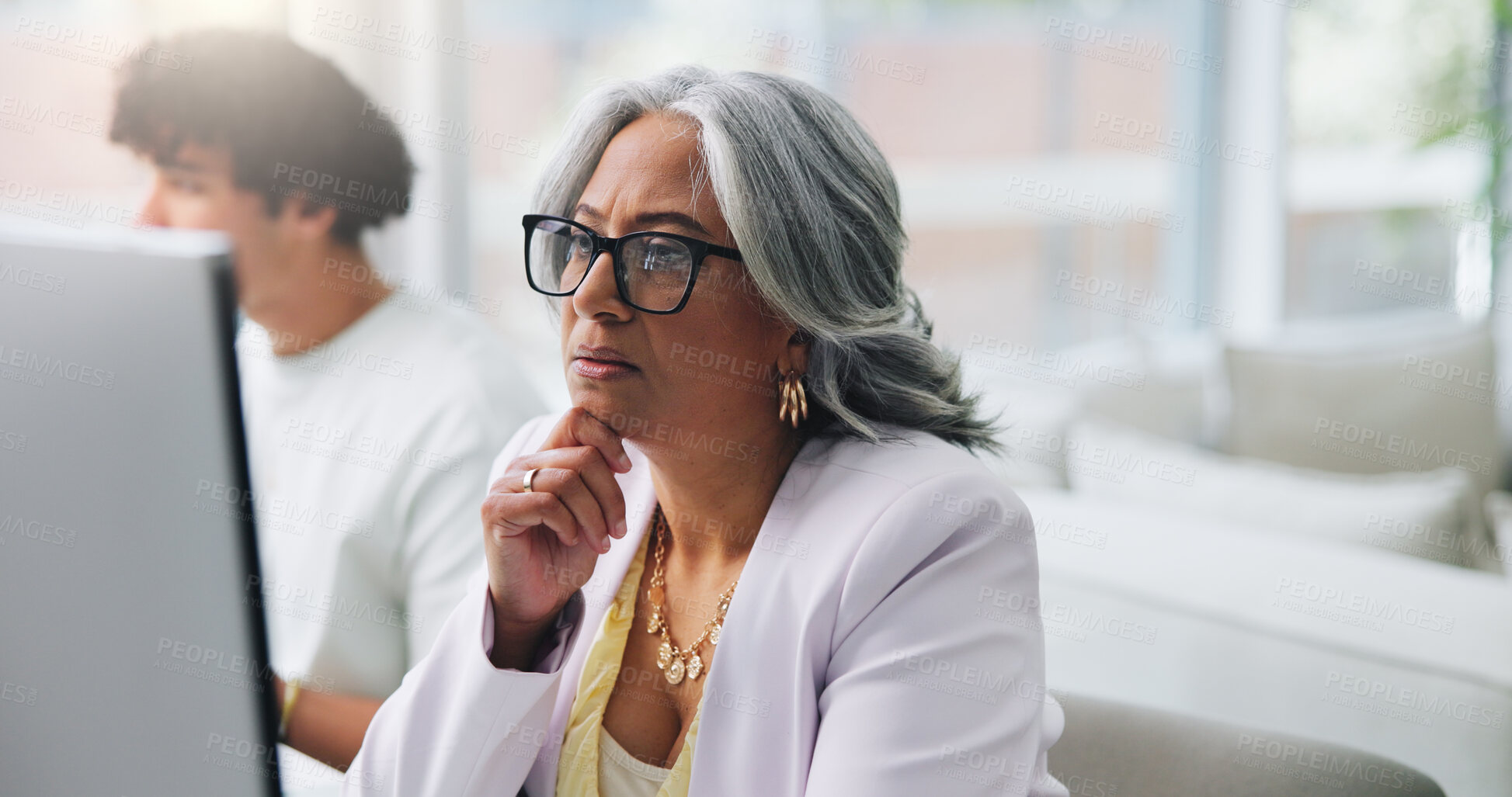 Buy stock photo Reading, glasses and woman with computer, office and serious for article on web, reporter and online. Coworking, mature journalist and person with eyewear for story, vision and editing in newsroom