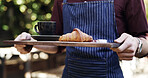 Breakfast, hands and waiter outdoor at restaurant with hospitality, order or customer service. Coffee, croissant and male server with morning meal and drink for health, wellness or snack at cafe.