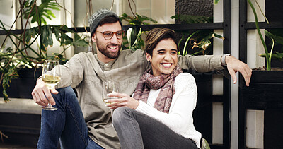 Buy stock photo Relax, wine and couple outdoor at restaurant for date on holiday together with bonding and connection. Happy, conversation and man with woman for drinking alcohol beverage at cafe on vacation.