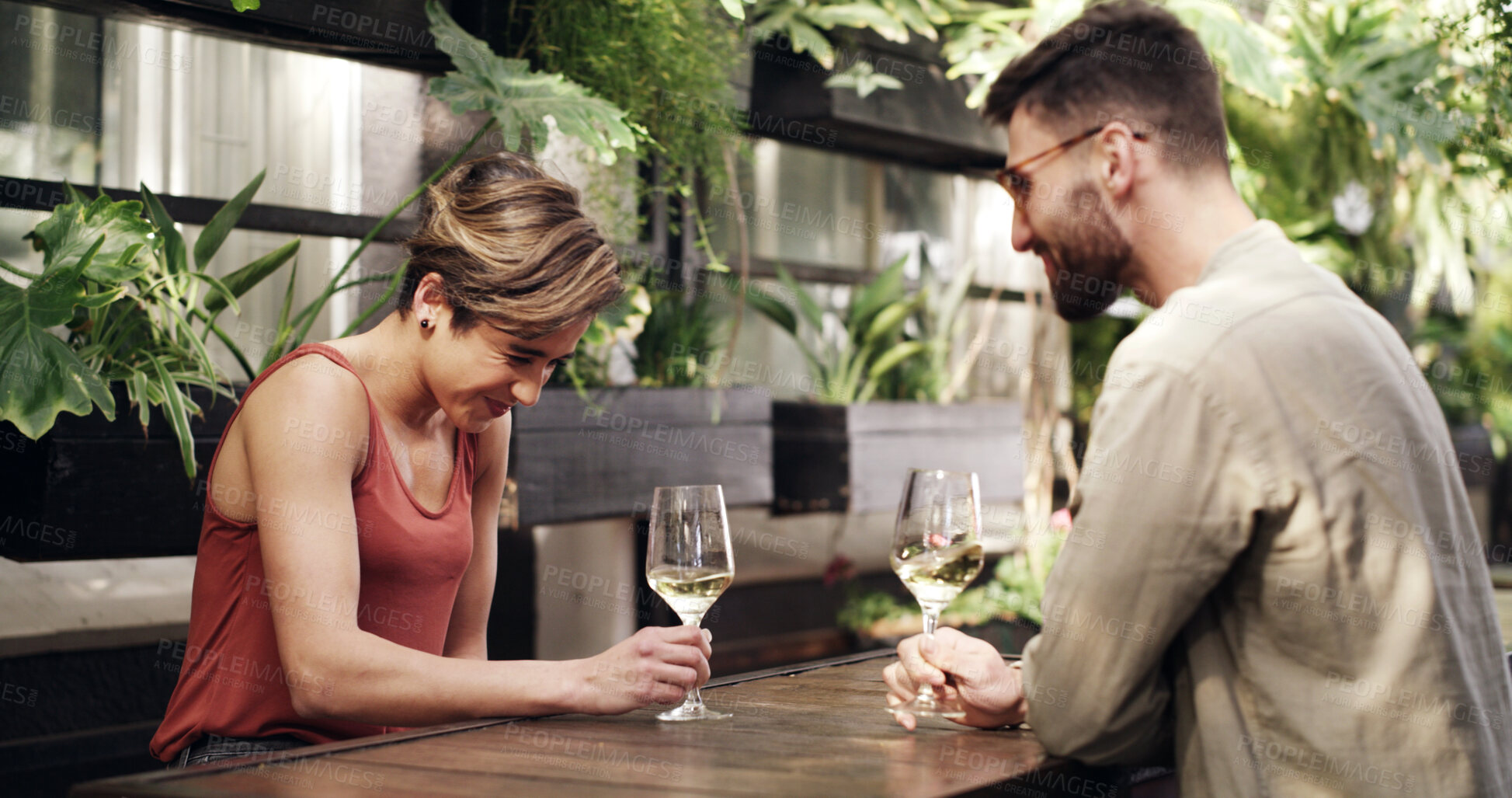 Buy stock photo Love, laugh or couple in in restaurant with wine, connection or bonding together on anniversary. Happy, partner or people in bistro with alcohol, honeymoon or romantic date in healthy relationship.