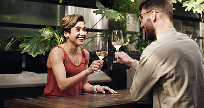 Buy stock photo Wine, happy couple and toast at restaurant for date, laugh or celebration of love with partner. Man, woman and cheers with alcohol glass for connection together, romance and funny joke on anniversary