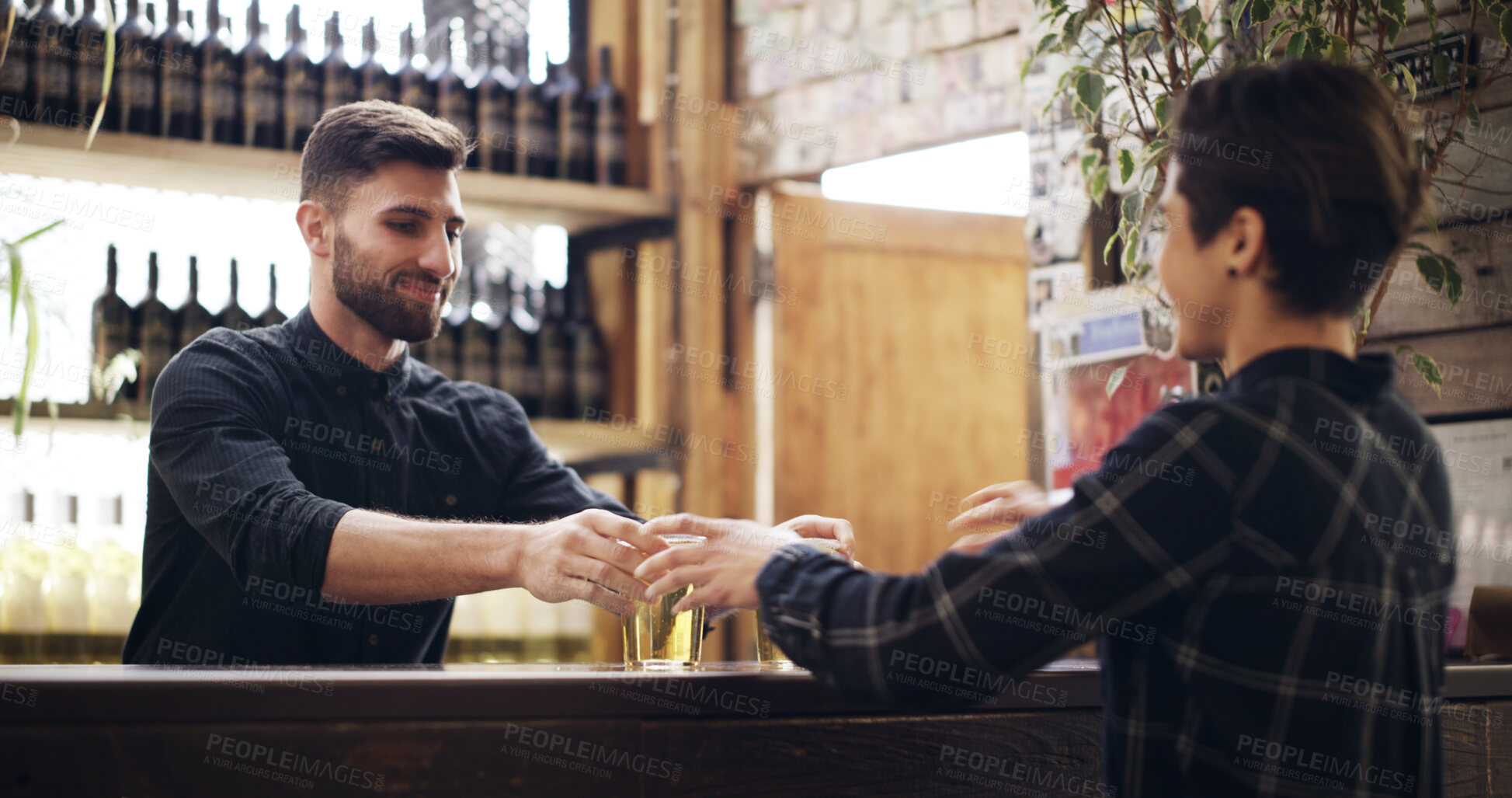 Buy stock photo Woman, bartender and serving alcohol at pub for happy hour, order and customer service. Smile, barman and female person at counter with beer, cultural experience and beverage at hospitality industry