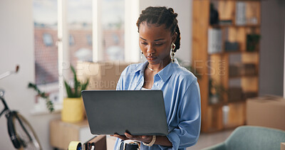 Buy stock photo Ecommerce, woman and research in office with laptop, logistics email or update for stock distribution. Black person, reading and browse in workplace with computer, shipping website and online order.