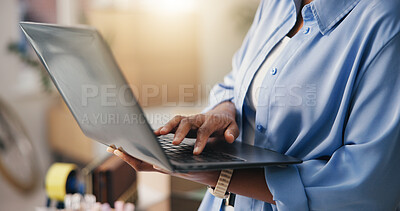 Buy stock photo Person, hands and laptop with typing for logistics, courier service or seller in small business. Distributor, supplier and tech with info for delivery order, shipping or e commerce startup in home