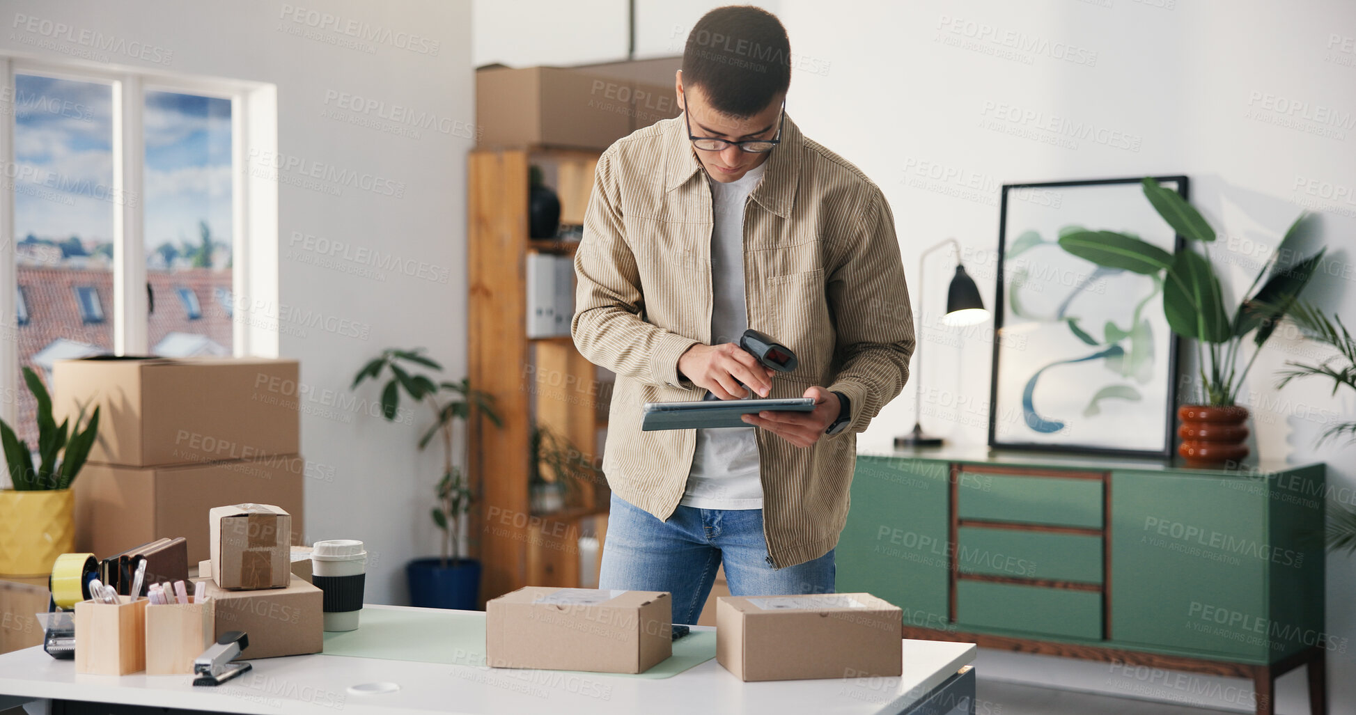 Buy stock photo Barcode scanner, boxes and tablet with man in logistics office for delivery or distribution tracking. App, small business and supply chain with employee at work for manageent of shipping schedule