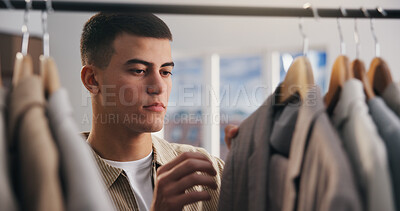 Buy stock photo Choice, fashion and man in boutique for shopping, stylish clothes and luxury retail. Person, consumer and customer in store, thinking or decision for fabric, promotion or discount with sale or doubt