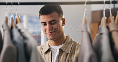 Buy stock photo Decision, fashion and happy man in boutique for shopping, stylish clothes and luxury retail. Person, contemplation and customer in store, thinking and choice for fabric, promotion and discount deal