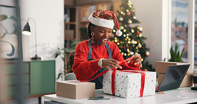 Buy stock photo Christmas, gift and unboxing with black woman in office for holiday celebration, startup or surprise. Festive season, present and dropshipping with employee and box for secret Santa in small business