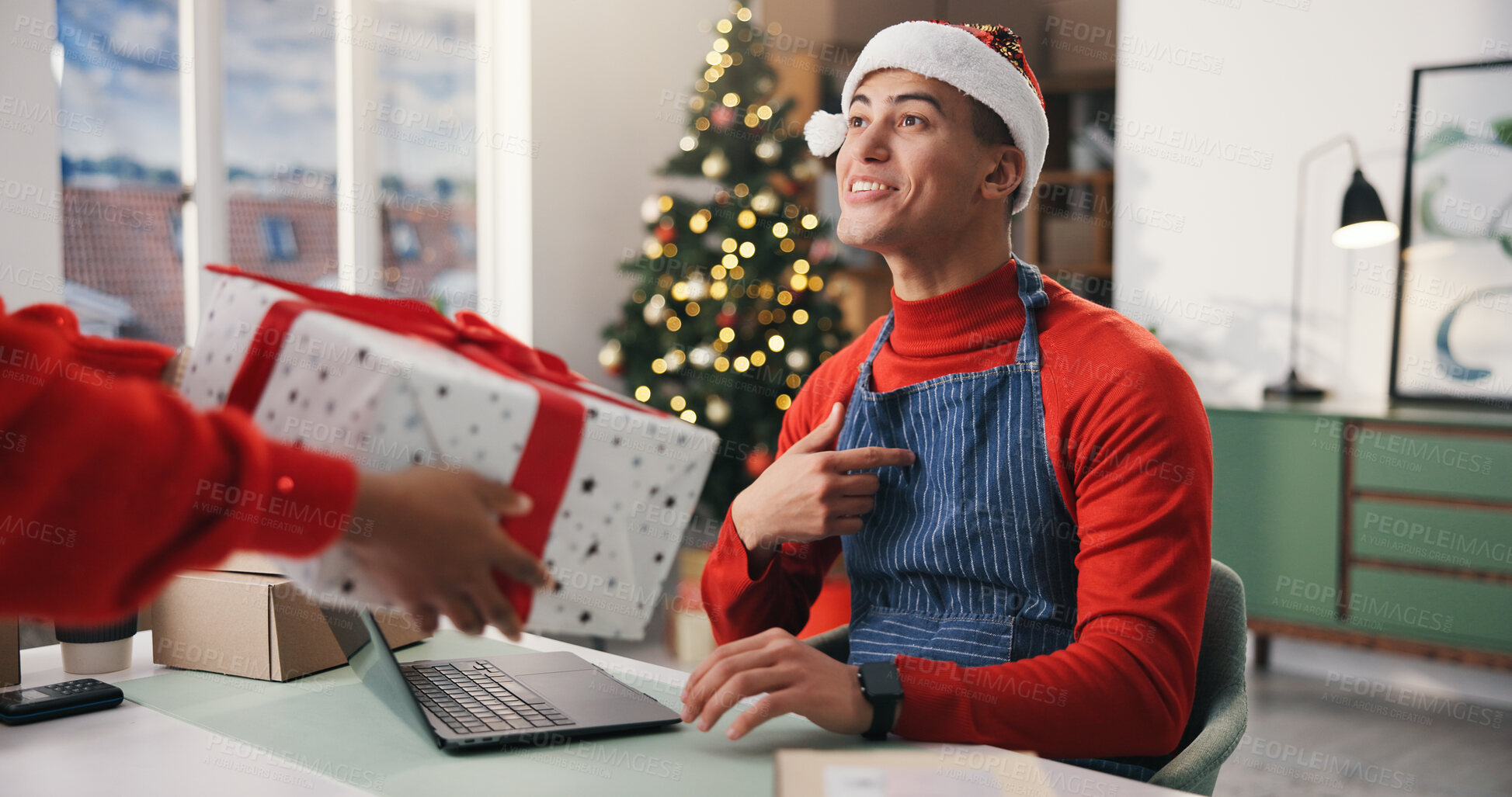 Buy stock photo Christmas, gift and surprise with man in office for holiday celebration, startup and laptop. Festive season, present and dropshipping agency with employee and box for secret Santa and small business