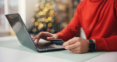 Buy stock photo Christmas, credit card and laptop with hands of woman in home for festive planning or online research. Computer, ecommerce and gift search with person typing in apartment for holiday tradition