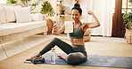 Fitness, selfie or woman with flexing in home, post workout picture or social media update for pride. Exercise complete, wink or strong influencer with photography in lounge, smile or training vlog