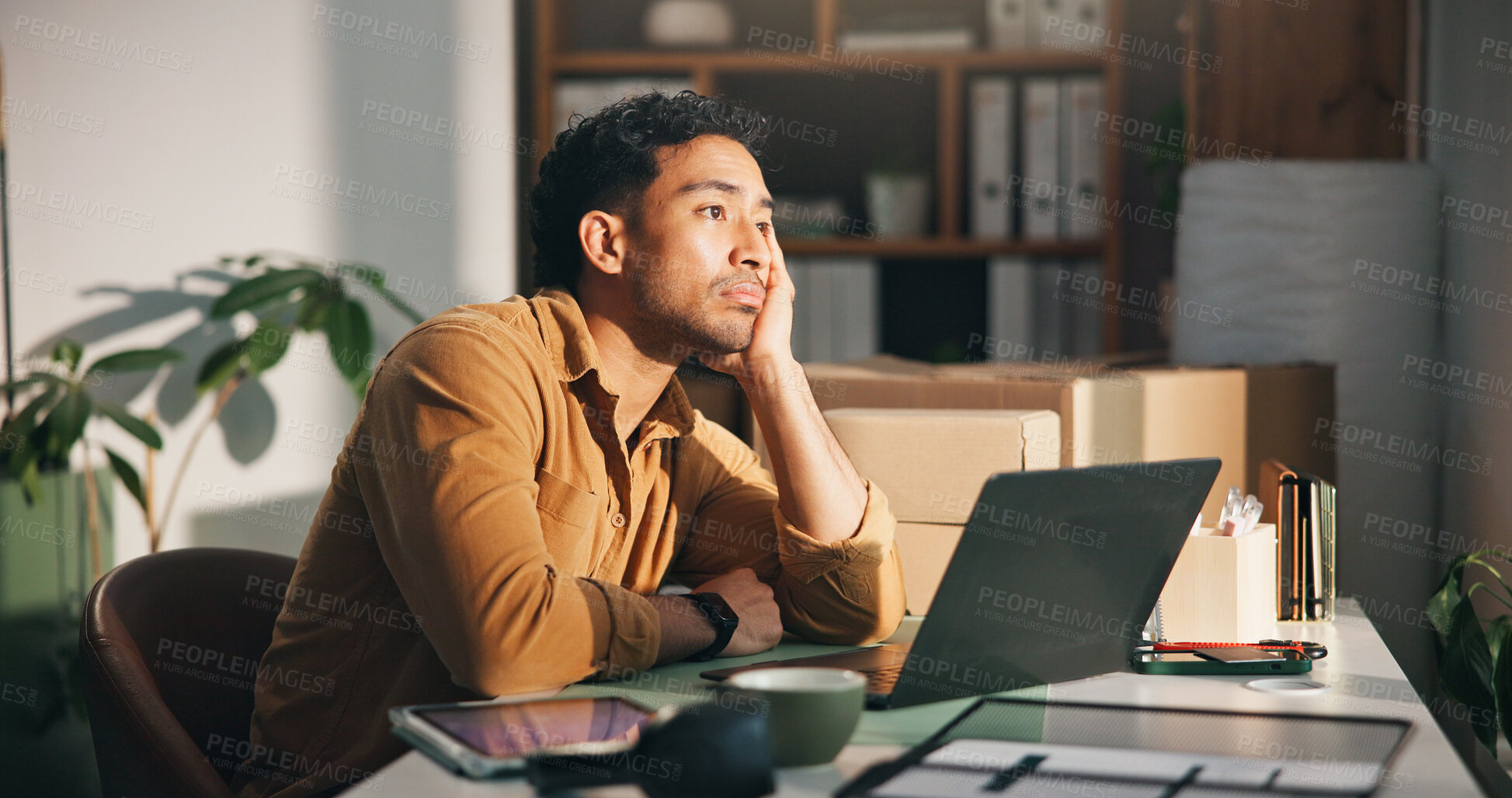 Buy stock photo Laptop, logistics and thinking with man in office for delivery, distribution or shipping of boxes. Bored, computer and supply chain with ecommerce employee at desk in workplace for courier service