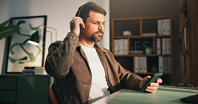 Buy stock photo Headphones, phone and man with break in home office, music listening and podcast for remote work. Mobile, playlist search and freelancer with tech for streaming, radio app and album for productivity