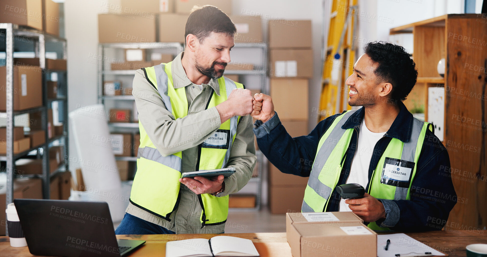 Buy stock photo Logistics, people and fist bump in warehouse with tablet, shipping success and collaboration for sales. Supply chain, happy men and celebration in depot with tech, delivery achievement and milestone.
