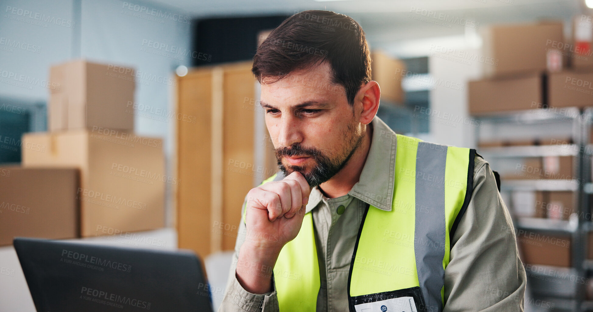 Buy stock photo Logistics, man and reading in depot with laptop, problem solving and thinking for shipping update. Supply chain, person and contemplation in workplace with computer, courier website and online order.