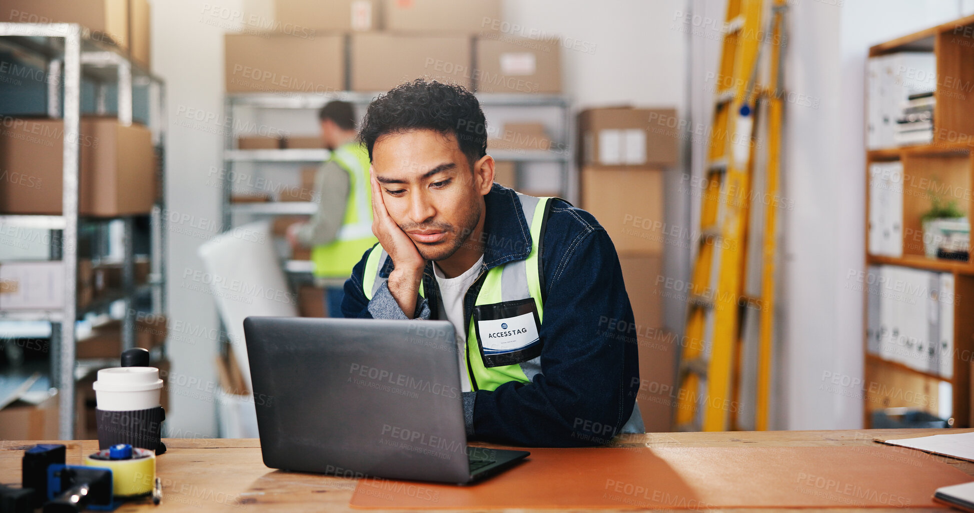 Buy stock photo Shipping, reading and bored man with laptop in warehouse for supply chain, logistics or procurement. Computer, distribution and tired entrepreneur in office, ecommerce email and lazy with burnout