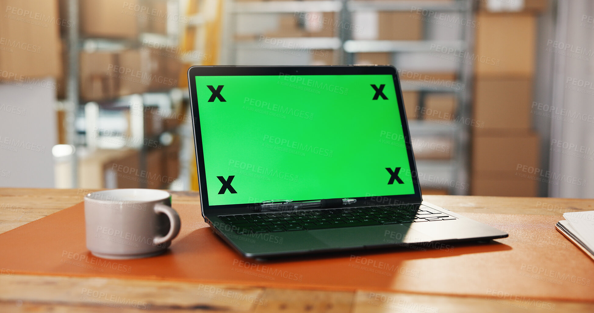 Buy stock photo Logistics, green screen and laptop in warehouse for website, work station or distribution log at desk. Tech display, mockup space or cup in storage for export information, delivery schedule or supply