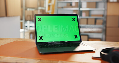 Buy stock photo Distribution, green screen and laptop in warehouse for website, work station or logistics log at desk. Tech display, mockup space or cup in storage for export information, delivery schedule or supply