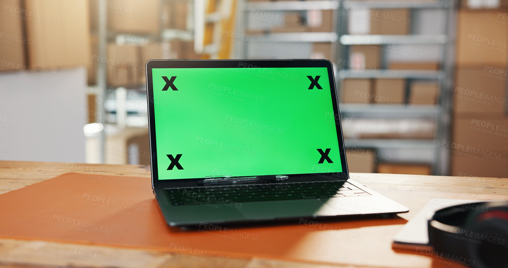 Buy stock photo Distribution, green screen and laptop in warehouse for website, work station or logistics log at desk. Tech display, mockup space or cup in storage for export information, delivery schedule or supply