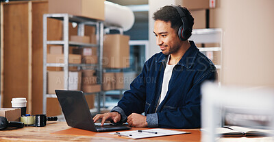 Buy stock photo Headphones, laptop and logistics with man in office for delivery schedule or storage management. Agenda, music and planning with employee person in courier workplace for supply chain business
