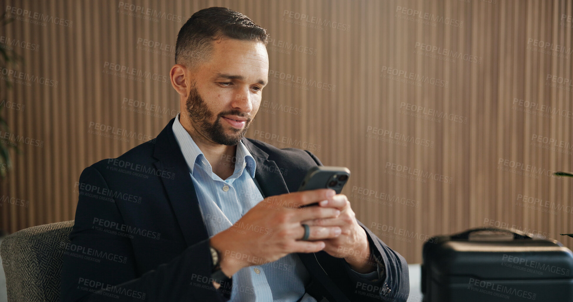 Buy stock photo Investor, luggage and man in airport, smartphone for online flight schedule and social media. Person, trader and professional on chair, cellphone and email for visa application or global trading deal