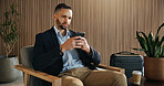 Investor, luggage and man in airport, cellphone for online flight schedule and social media. Person, trader and professional on chair, smartphone and email for visa application, app or communication