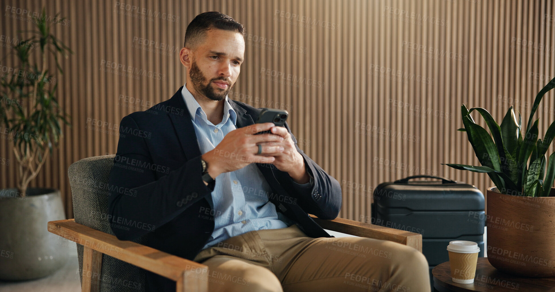 Buy stock photo Investor, luggage and man in airport, cellphone for online flight schedule and social media. Person, trader and professional on chair, smartphone and email for visa application, app or communication