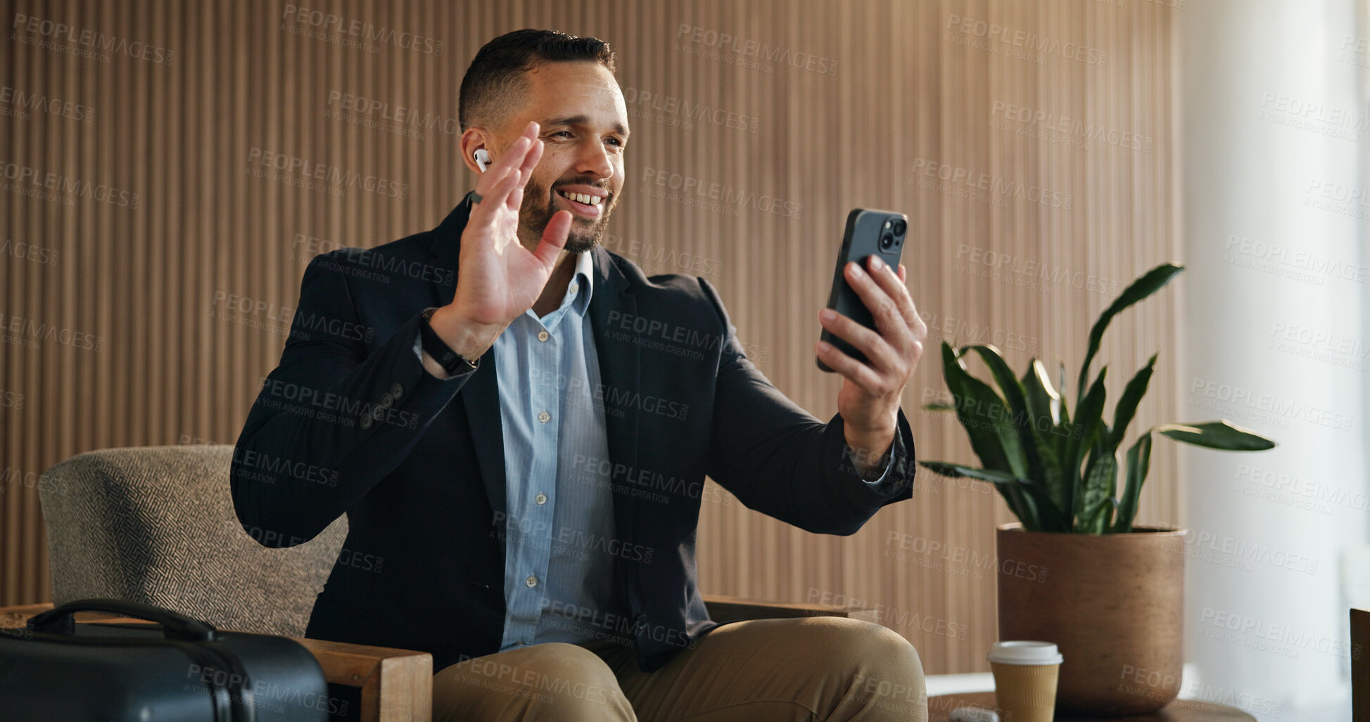 Buy stock photo Video call, phone and wave with man in airport lounge for chat, layover update and contact. Communication, luggage and travel with person and mobile in vip lobby for connection and business class
