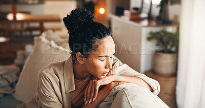 Buy stock photo Sofa, sad and woman in home with anxiety, worry or remember memory of trauma in living room. House, unhappy and person with depression, mental health crisis or thinking with stress for mistake