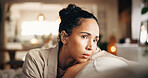 Thinking, sad and woman on sofa with choice, problem solving and mistake in wrong decision. Confused mindset, bokeh or female person in living room with doubt, questioning or regret in past memory.