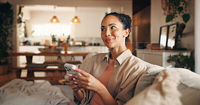 Buy stock photo Phone, thinking and typing with woman on sofa in living room of home for break, chilling or me time. App, ideas and text message with happy person in apartment for browsing or mobile communication