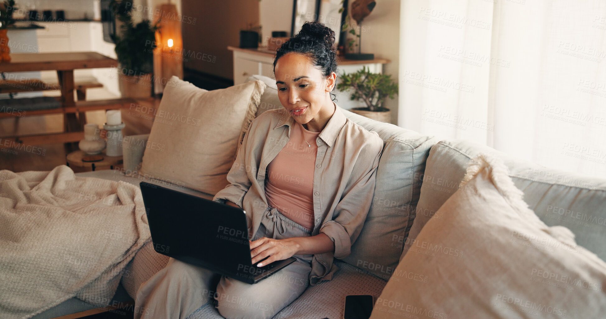 Buy stock photo Woman, typing and research on sofa with laptop, remote work and website for digital marketing trend. Person, reading and browsing in home with computer, plan and freelance job for online advertising.